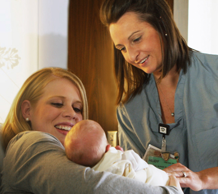 Doctor with woman and baby