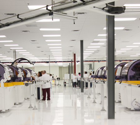 Lab operators inspect backside lens cutting generators