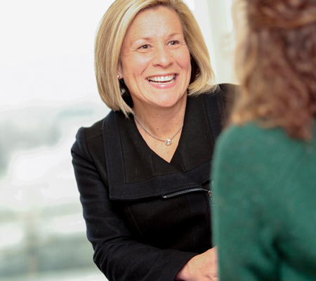 Lori Schoonmaker meets with a health plan customer