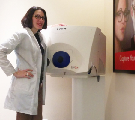 Dr. Angelina Popovic, O.D., poses with the Optos Optomap scanner