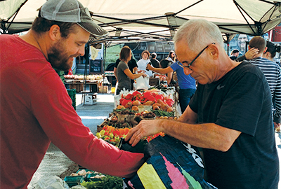 Two men at a farmer's market