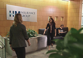 Two women meeting in lobby of building