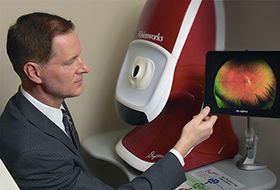 Dr. Todd Shuba, an optometrist at the Visionworks location in the Highmark Health headquarters building in Pittsburgh, demonstrates the Optomap