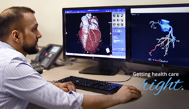 Dr. Moneal Shah studies the results from the HeartFlow Analysis