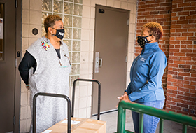 Dr. Christina Wilds from the Highmark Foundation delivers masks to Dr. Sharon Higginbothan, chief operating officer at Bethlehem Haven