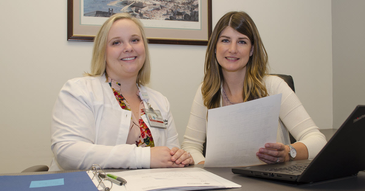 Nurse practitioner Katrina Siders (left) and program coordinator Ashley Schultz (right) in a Perinatal Hope Program office setting