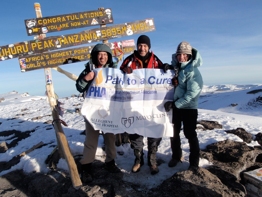 Dr. Benza (center), with Dr. Robert Franz from the Mayo Clinic (left) and Jessica Lazaar, a physician’s assistant, at the peak of Mt. Kiliminjaro