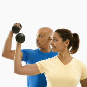 man and woman doing bicep curls