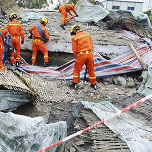 Workers cleaning up after disaster