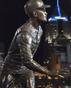 Roberto Clemente statue outside PNC Park in Pittsburgh, with the Highmark building across the river in the background