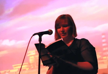 Jenny reading her work at an event