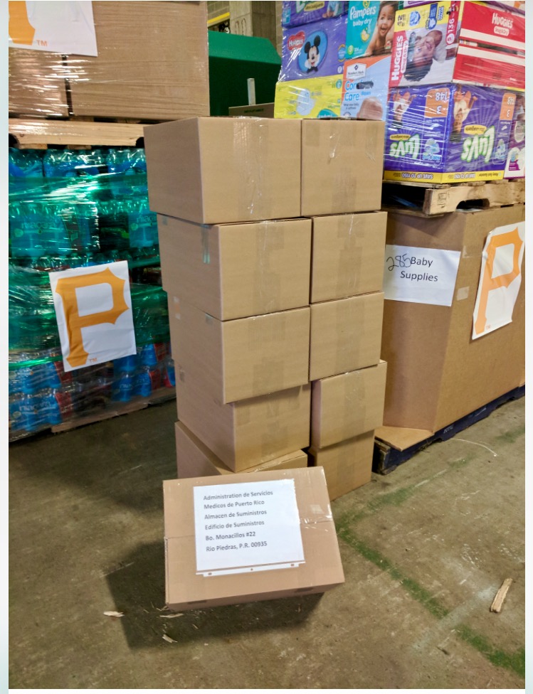 Boxes and pallets of humanitarian and medical supplies ready to load on the Pirates first disaster relief plane headed to Puerto Rico