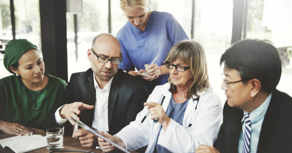 Doctors and health professionals discussing treatment plan