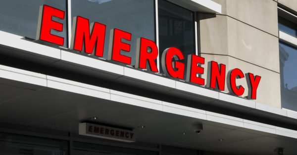 The outdoor emergency sign above the entrance to a hospital