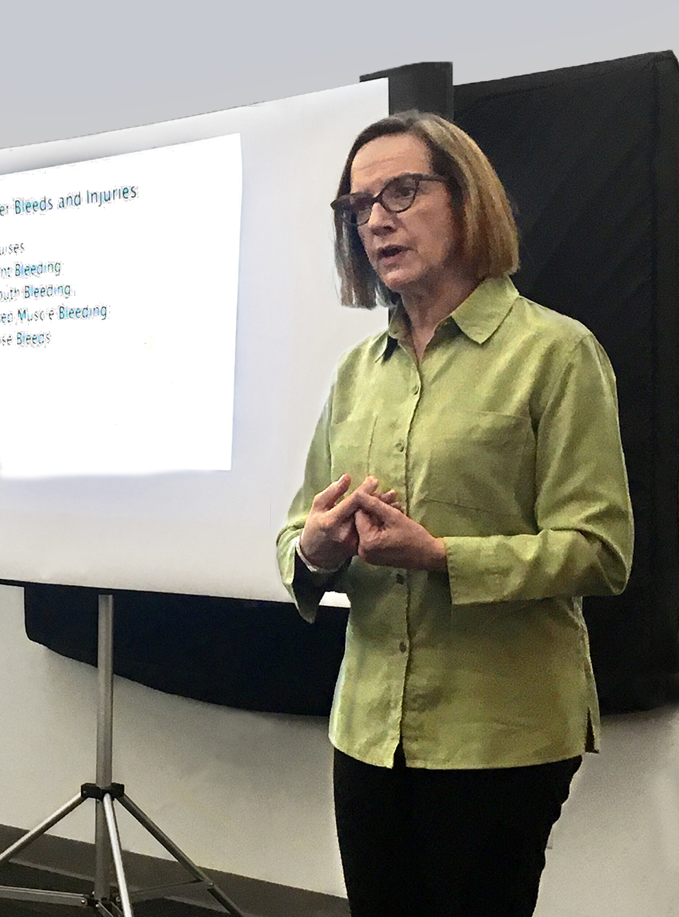 Nancy Stinely, a complex case nurse manager for Highmark, speaks with a group of parents with children who were recently diagnosed with hemophilia.