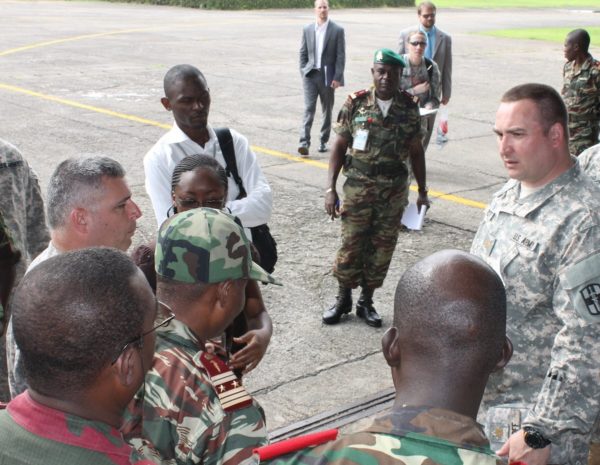 Tony Groff meeting with group of people in outdoor setting in Cameroon, Africa