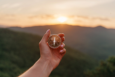 Person holding a compass